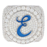 Square silver ring with sparkling white gemstones and a blue letter 'E' in the center.